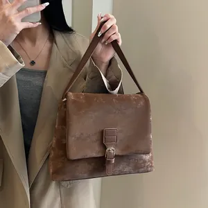 Vintage dark brown leather messenger bag for women with classic flap and buckle strap