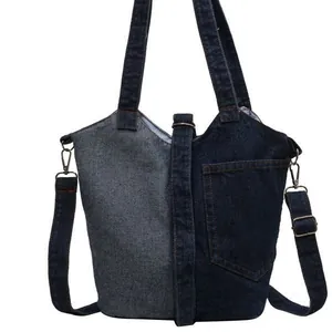 Vintage denim bucket bag with indigo contrast stitching and adjustable shoulder strap