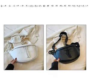 Detail of crescent crossbody bags in black and white leather with chunky chain and tassels
