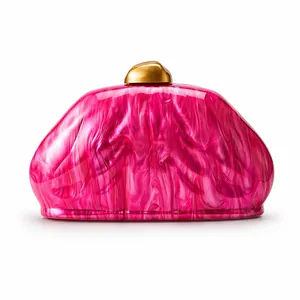 Detail of pink marble acrylic evening clutch bag with golden metal clasp and glossy finish