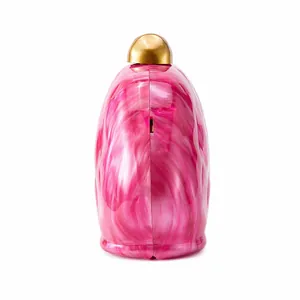 Detailed macro of pink and white marble texture on acrylic shell clutch with gold clasp