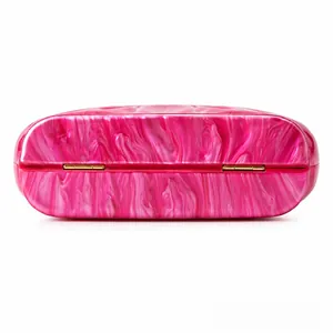 Detail view of pink marble pattern acrylic material with luxury gold metal hinges
