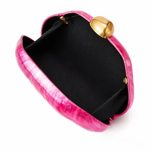 Pink marble acrylic evening bag with golden ball clasp and black inner lining detail