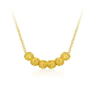 Macro shot of 925 sterling silver gold-plated bead pendant with a fine O-link chain
