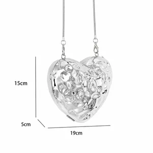 Chic silver heart-shaped evening bag with liquid metal texture and chain strap, 19cm wide