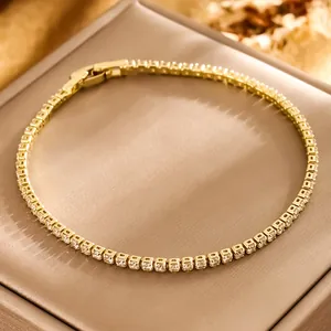 Elegant gold tennis bracelet featuring square AAA cubic zirconia with a secure fold-over clasp