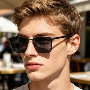 Close-up of polarized square frame sunglasses with black frame and silver bridge on male model
