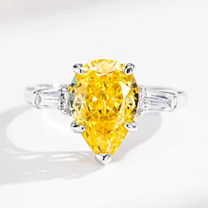 Sparkling S925 sterling silver ring with large pear cut yellow gemstone and side diamonds