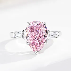 Elegant S925 silver ring with pear-shaped pink gemstone and side step-cut diamonds
