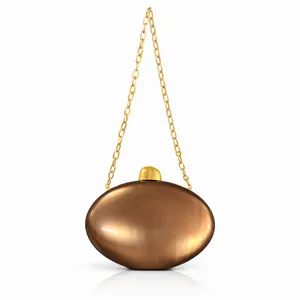 Detail of bronze semi-circle acrylic clutch with golden chain and metallic finish