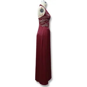 Detail of burgundy evening dress showing lace floral texture and satin fabric join