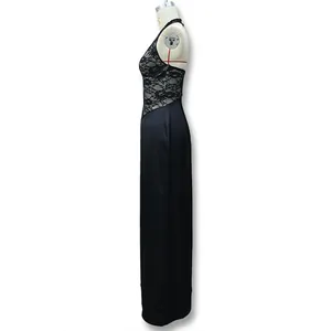 Detail of elegant black halter dress featuring delicate lace bodice and open back design
