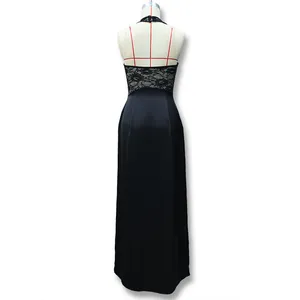 Detailed view of the backless halter neckline with delicate lace patchwork on black dress
