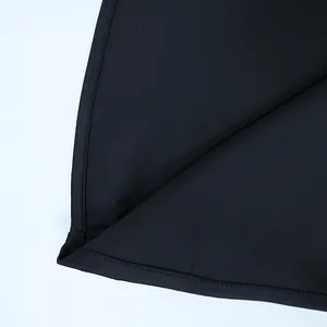 Close-up of high-quality sewing and stitched hem details on a black lace dress