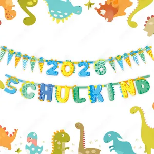 Close-up of Dinosaur themed Schulkind 2026 party banner with colorful school lettering