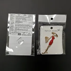 Modische Brosche mit rotem Kleid-Lady-Design und Straßsteinen in Klarsichtverpackung