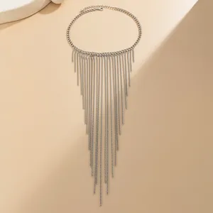 Macro shot of silver mesh fringe necklace with layered metal chains in V-shape design
