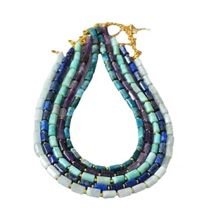 Five-layered gold chain necklace featuring cylindrical natural semi-precious stone beads