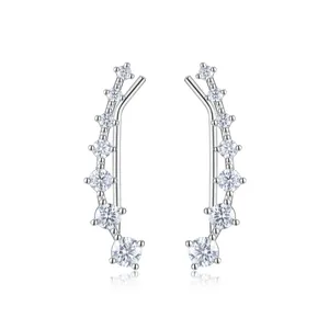 Detailed view of silver ear crawlers with seven graduated round-cut sparkling stones