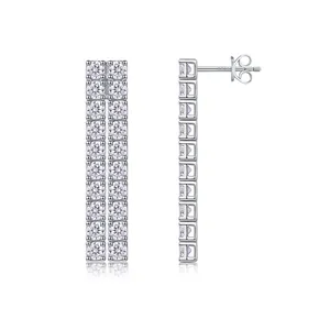 Macro shot of S925 sterling silver dangle earrings with double-row moissanite stones