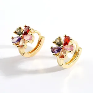 Detailed close-up of gold-plated petal huggie earrings with colorful zirconia stones