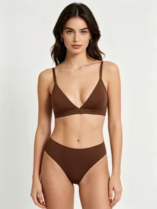 Detailed view of dark brown elastic wireless triangle bra and high-waist bikini set