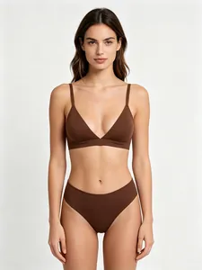 Chocolate brown stretch bra and high-cut panty set on a model against a grey backdrop