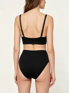Back view of black seamless stretch bralette and high-waist panty set for women