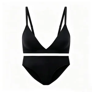 Macro detail of seamless black stretch wireless bra set with matching elastic panties