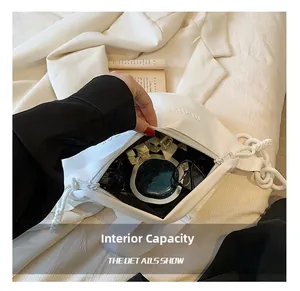 Internal capacity detail of white PU crossbody bag showing spacious storage space