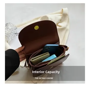 Close-up of the brown saddle bag interior showing internal capacity and pockets
