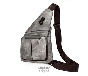 Vue latérale du sac bandoulière rétro gris avec trois zips et sangle marron