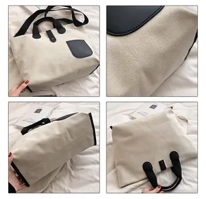 Detail view of canvas tote bag with black leather contrast pocket and sturdy handles