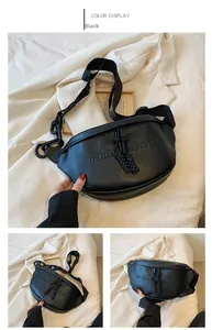 Detail of black PU crossbody bag featuring embossed logo and chunky chain strap
