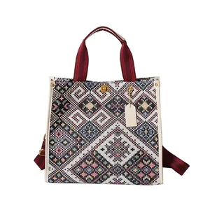 Borsa tote retrò in tessuto jacquard con finiture in pelle e chiusura dorata