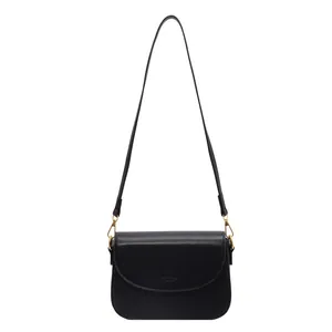 Classic black leather square crossbody bag with gold hardware and flap closure