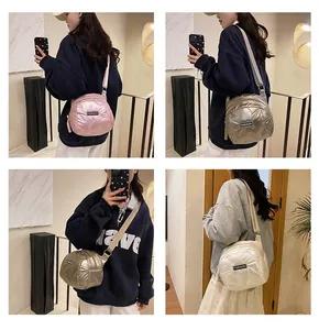 Close-up of quilted puffer crossbody bags in pink, gold, and beige with fashion tag