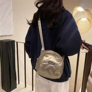 Champagne gold quilted puffer shoulder bag with a stylish metalic finish for women