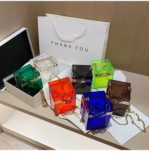Detail view of colorful acrylic handbag collection with acrylic chain and gold metal frames