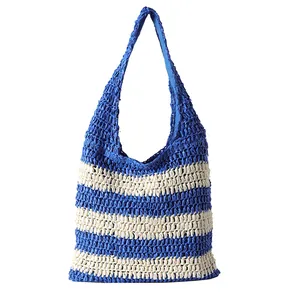 Large blue and white striped straw tote bag for beach vacations and summer travel