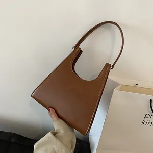 Sac sous le bras rétro minimaliste en cuir PU marron caramel avec design courbe unique