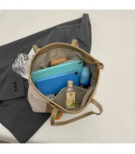 Top view of large canvas tote bag showing spacious interior with multiple items inside