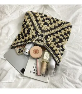 Detail view of woven crochet tote bag showing spacious interior with personal essentials