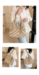 Detail of hand-woven straw hobo bag showing diamond crochet pattern and leather strap