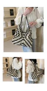 Detail of bohemian crochet tote with black and white geometric pattern and leather strap
