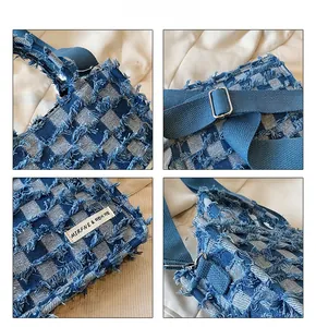 Detail view of blue checkered denim tote bag featuring fringed edges and adjustable strap