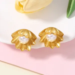 Vintage gold shell pearl earrings featuring a matte texture and elegant marine style