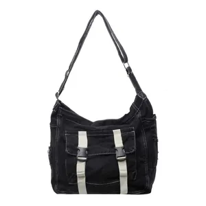 Black canvas messenger bag with contrast stitching and adjustable shoulder strap