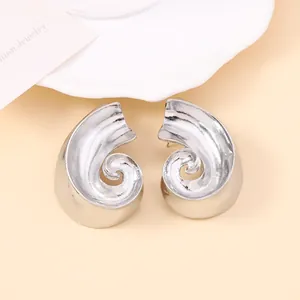 Vintage style irregular silver spiral metal stud earrings with a polished mirror finish