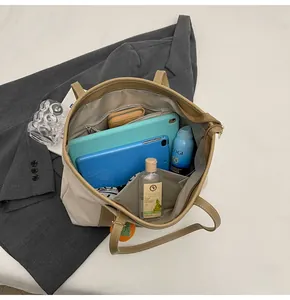 Interior view of large capacity tote bag with tablet, wallet, and skincare items